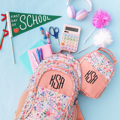 matching monogrammed backpack and lunch box in coral floral