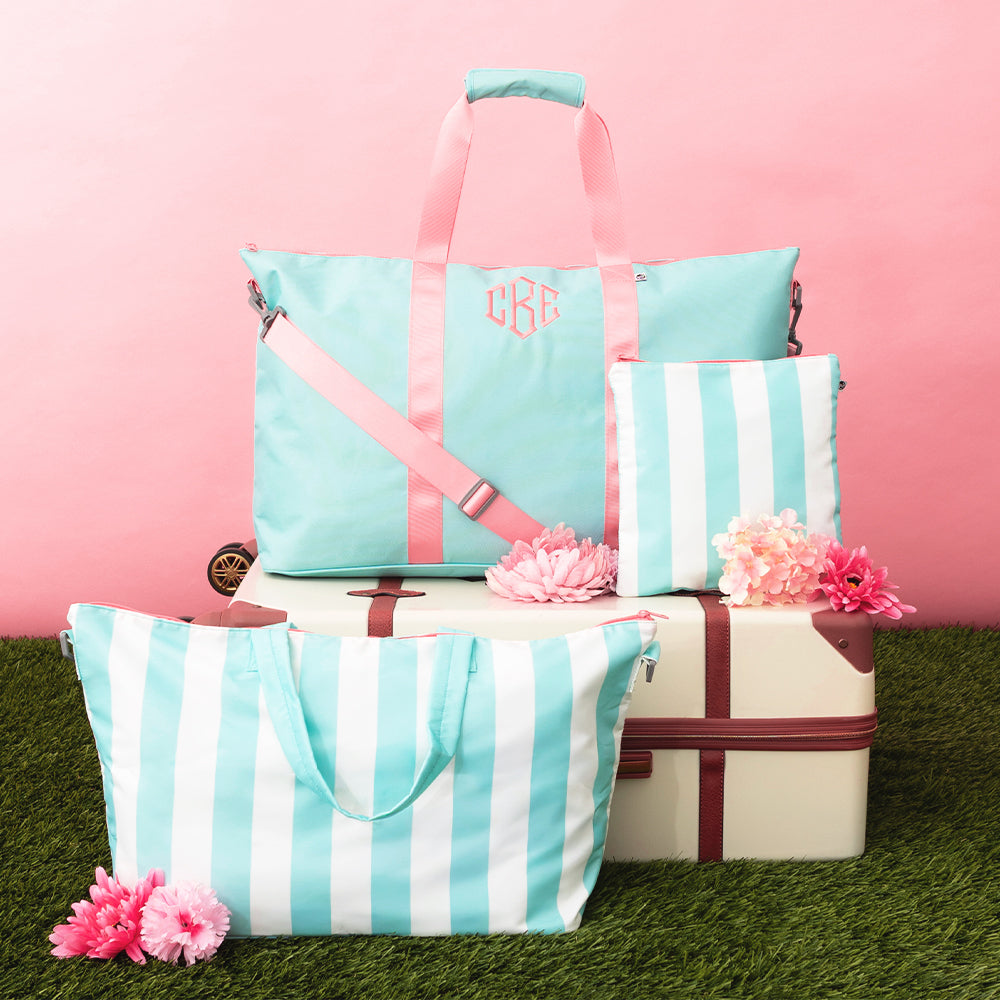 Mint bags with pink accents on a pink background