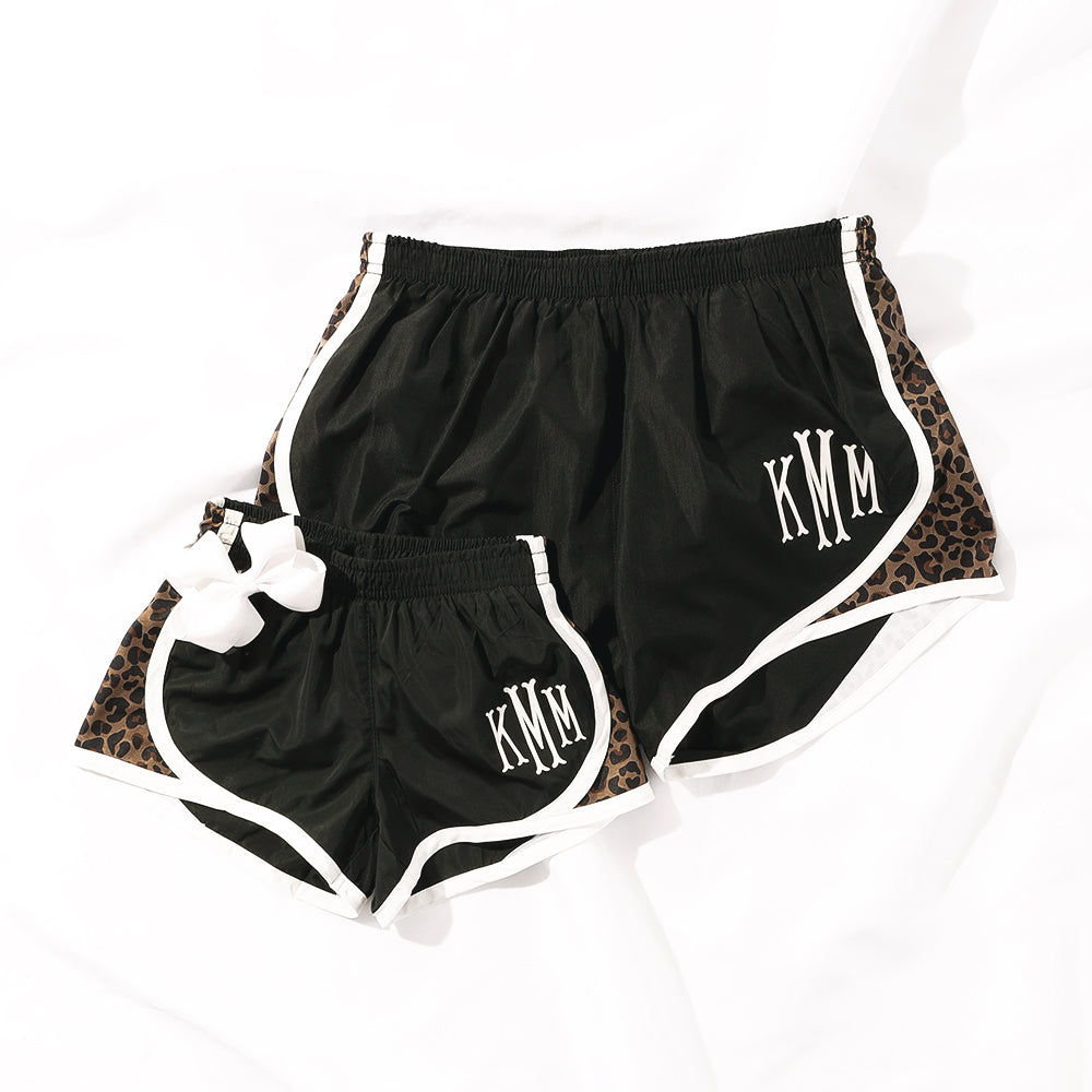 mom and me leopard monogrammed running shorts on white sheet