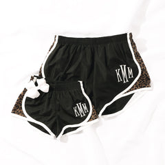 mom and me leopard monogrammed running shorts on white sheet