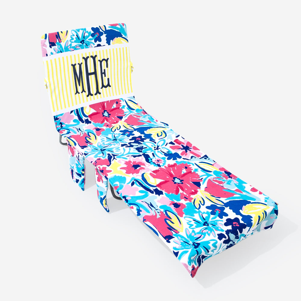 Colorful floral-patterned chair cover with a monogram