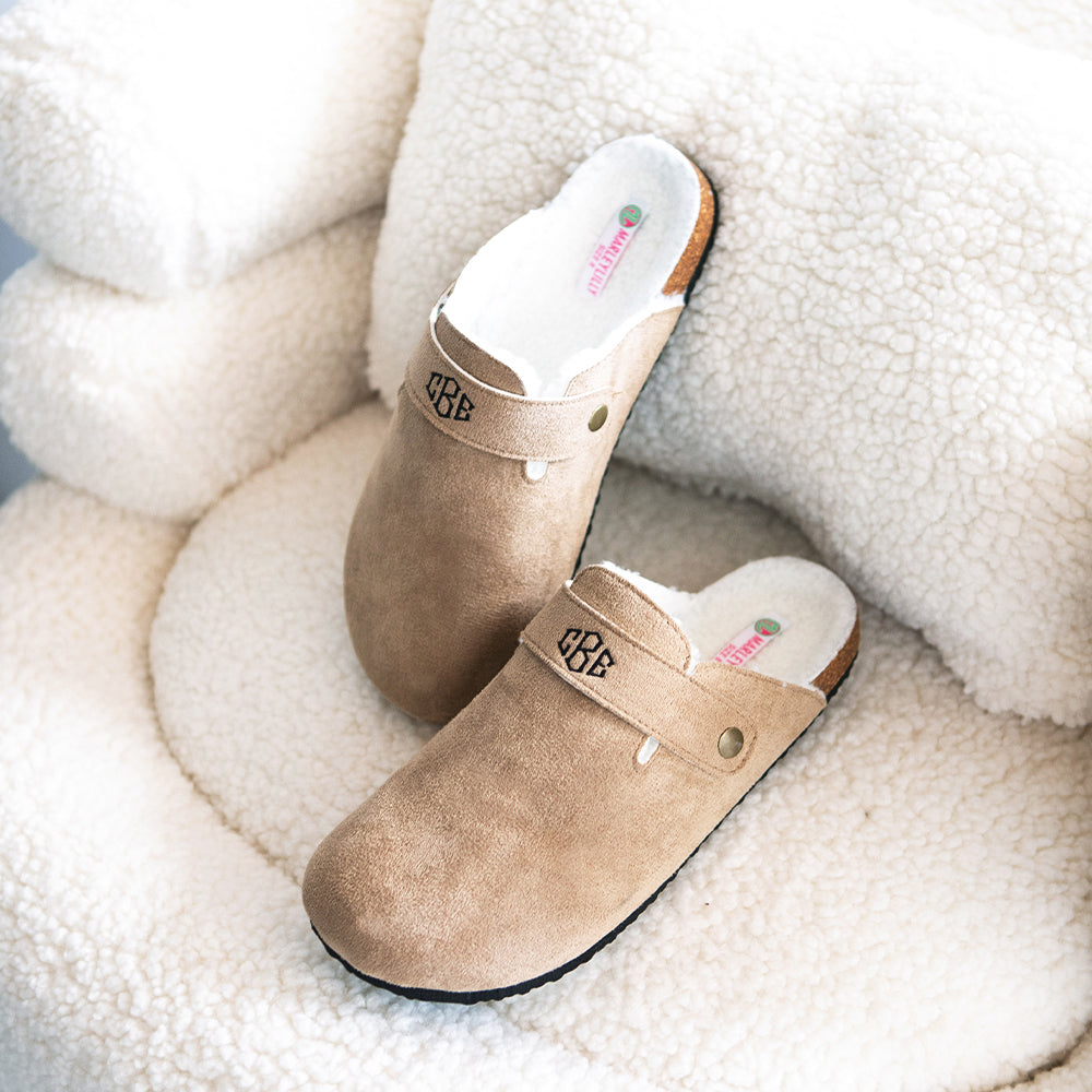monogrammed clogs on chair