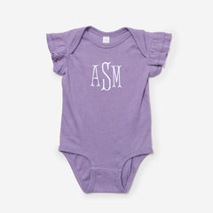 Purple baby onesie with ruffled sleeves and 'ASM' monogram on a white background
