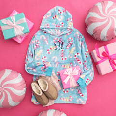 monogrammed kids blanket hoodie in candy cane cutie with christmas presents 