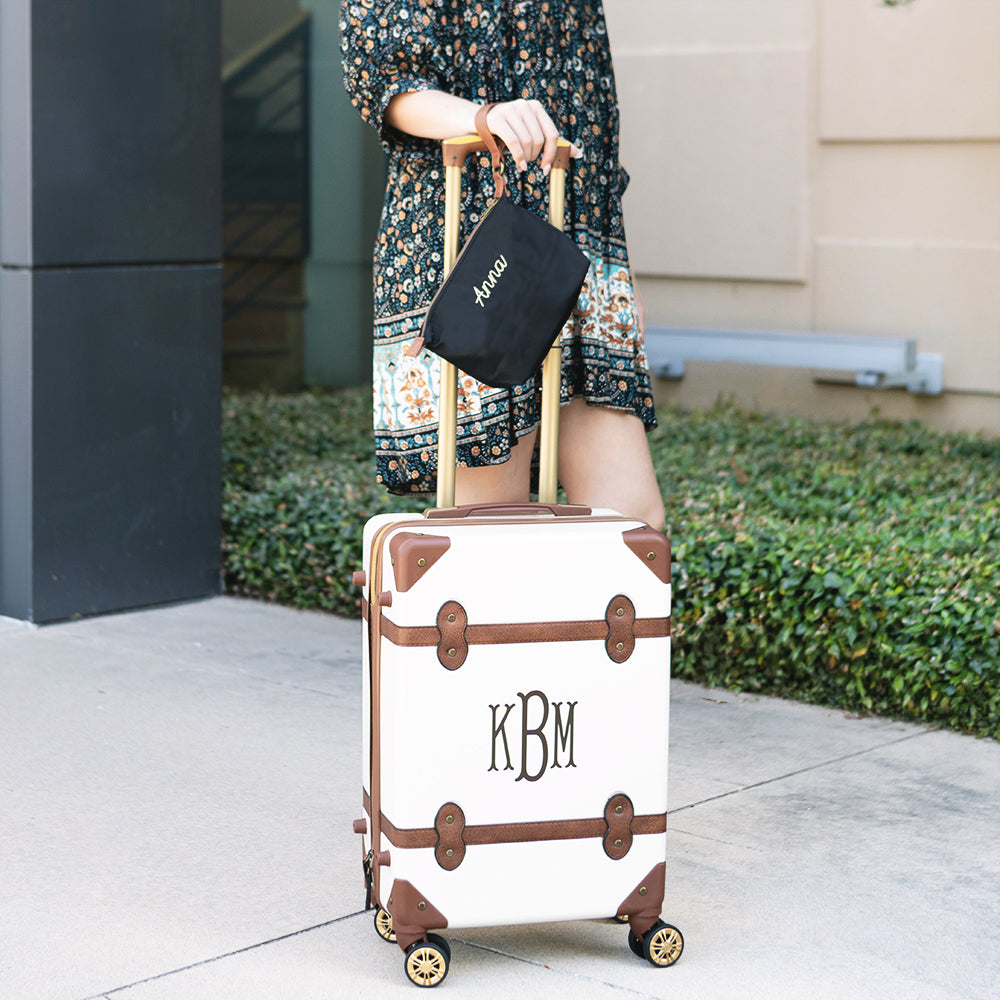 monogrammed lightweight wristlet in black with luggage 