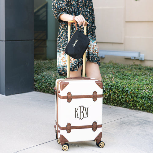 monogrammed lightweight wristlet in black with luggage 