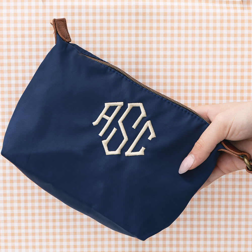 monogrammed lightweight wristlet in navy on gingham background 