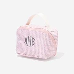 Pink seersucker toiletry bag with 'MHE' monogram on a white background