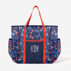 navy mesh beach bag with red straps and embroidered monogram