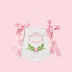 Decorative banner with pink ribbons on a pink background