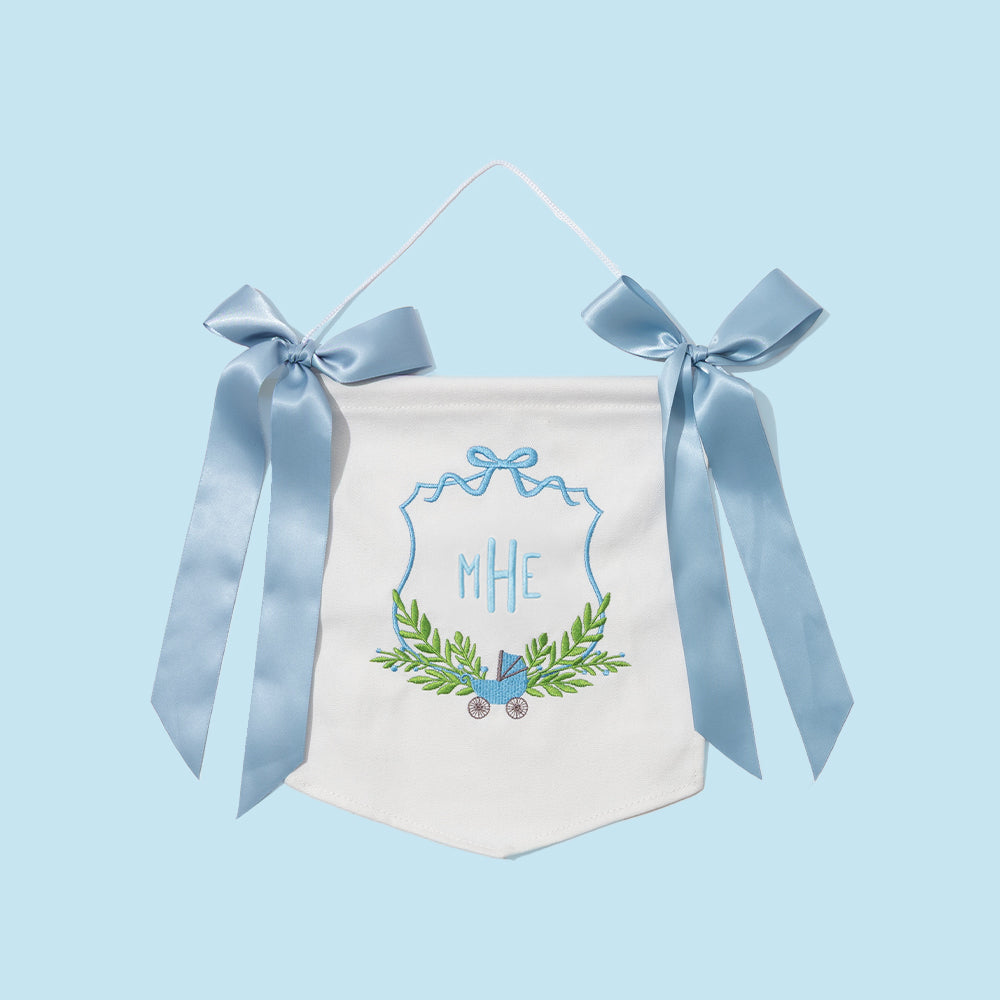 Decorative baby banner with blue ribbons on a light blue background