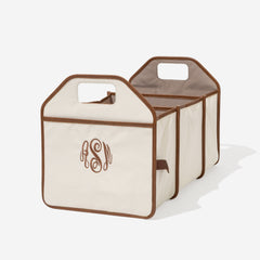 Ivory and brown storage caddy with monogram on a white background