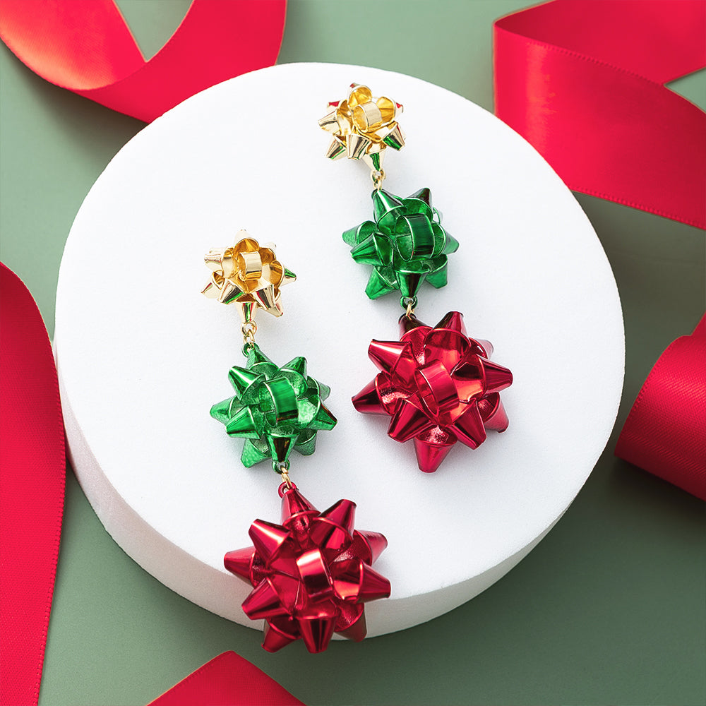 multi gift bow earrings on green with ribbons
