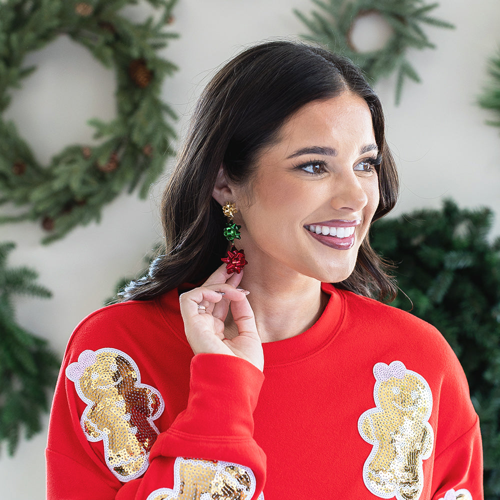 multi gift bow earrings on peyton