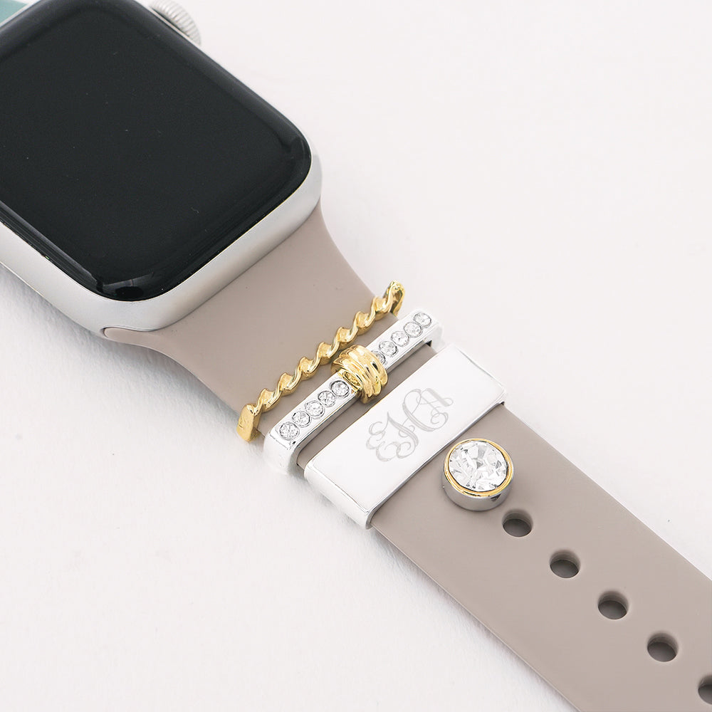 multi silver monogrammed smart watch charm set on beige apple watch band