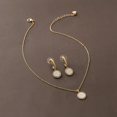 pave cable necklace and earrings on brown