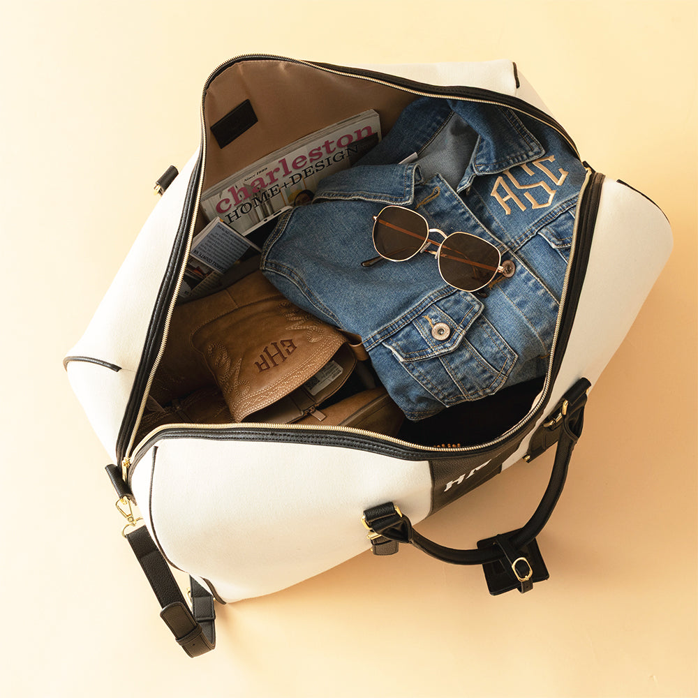ivory/black weekender bag inside shot