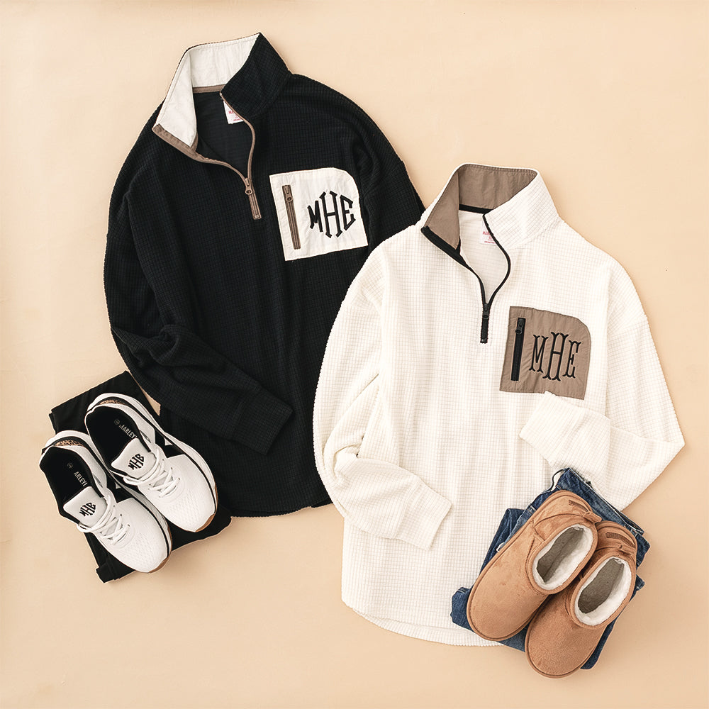 Grid Fleece Quarter Zip Pullover Black and Ivory flatlay