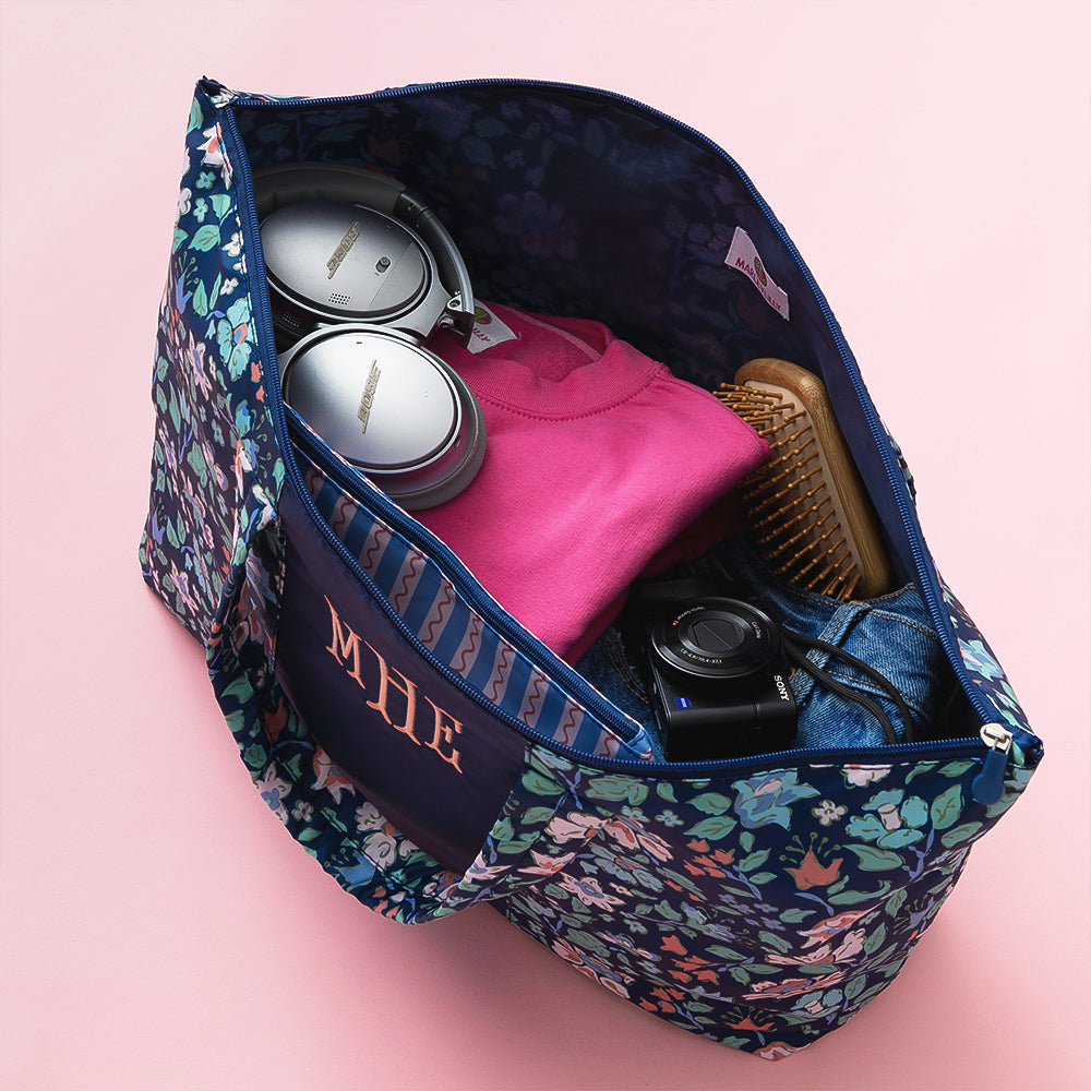 navy floral trellis packable duffel bag open shot
