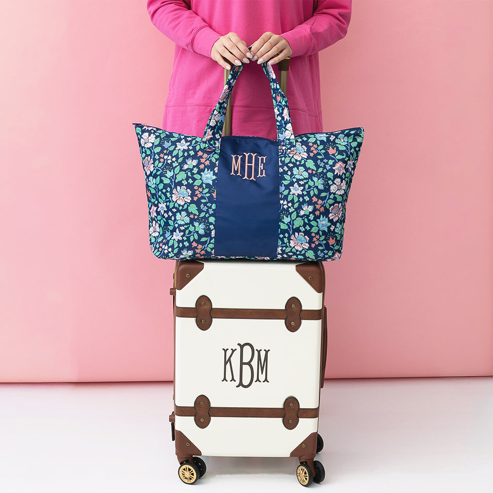navy floral trellis packable weekend duffel bag with suitcase