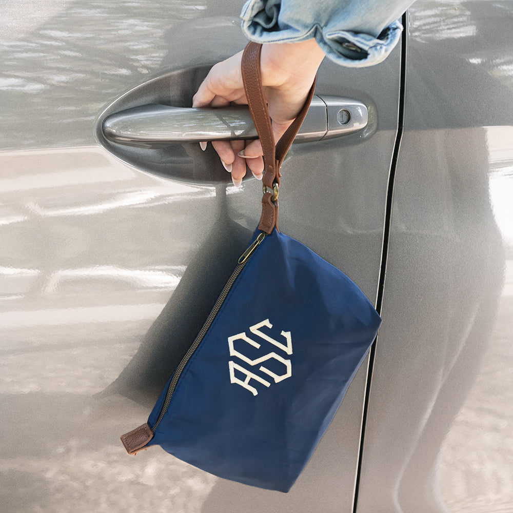 navy monogrammed lightweight wristlet and car 