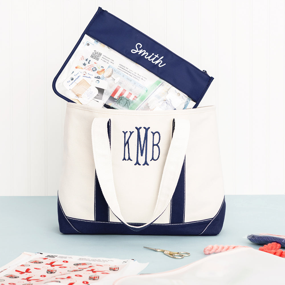 navy project bag with needlepoint supplies