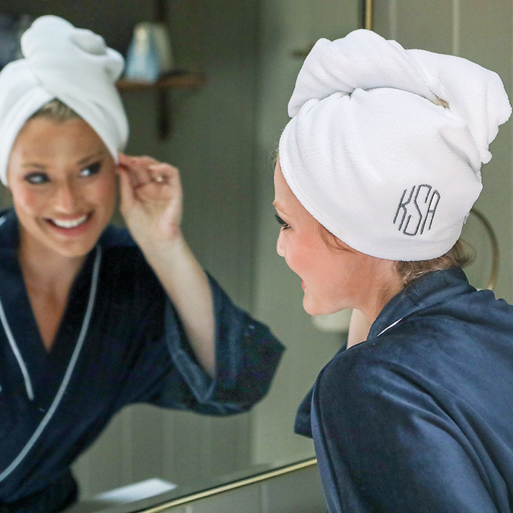 monogrammed hot pink hair towel in bathroom in mirror