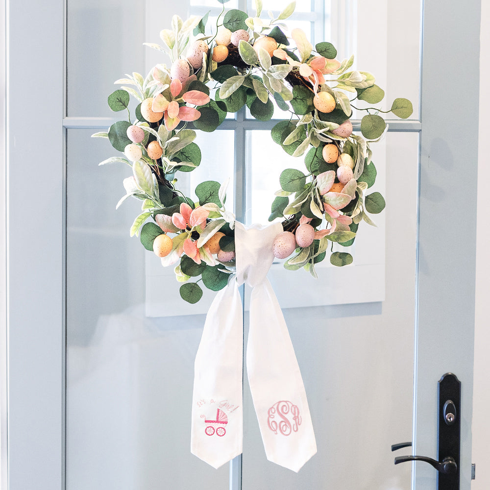 girl new baby wreath sash on door