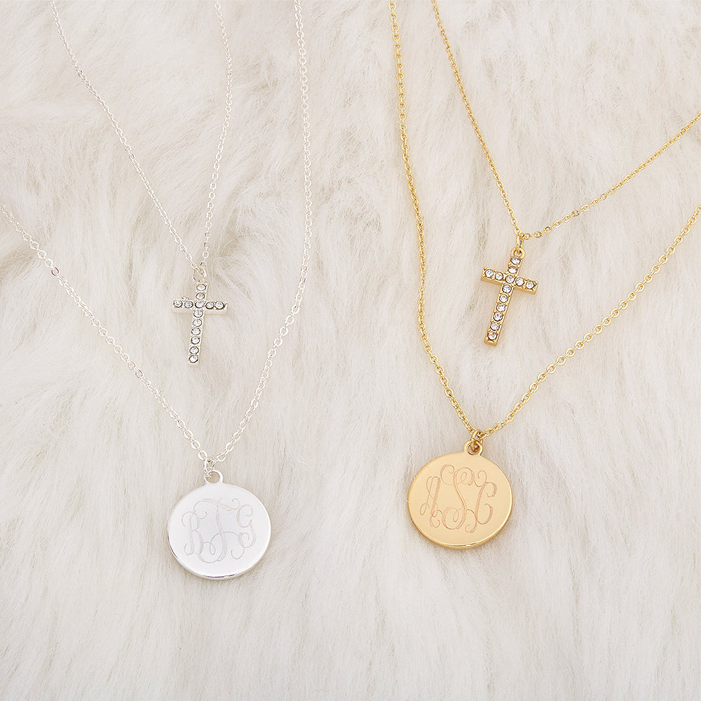 monogrammed layered cross necklaces in silver and gold on fur