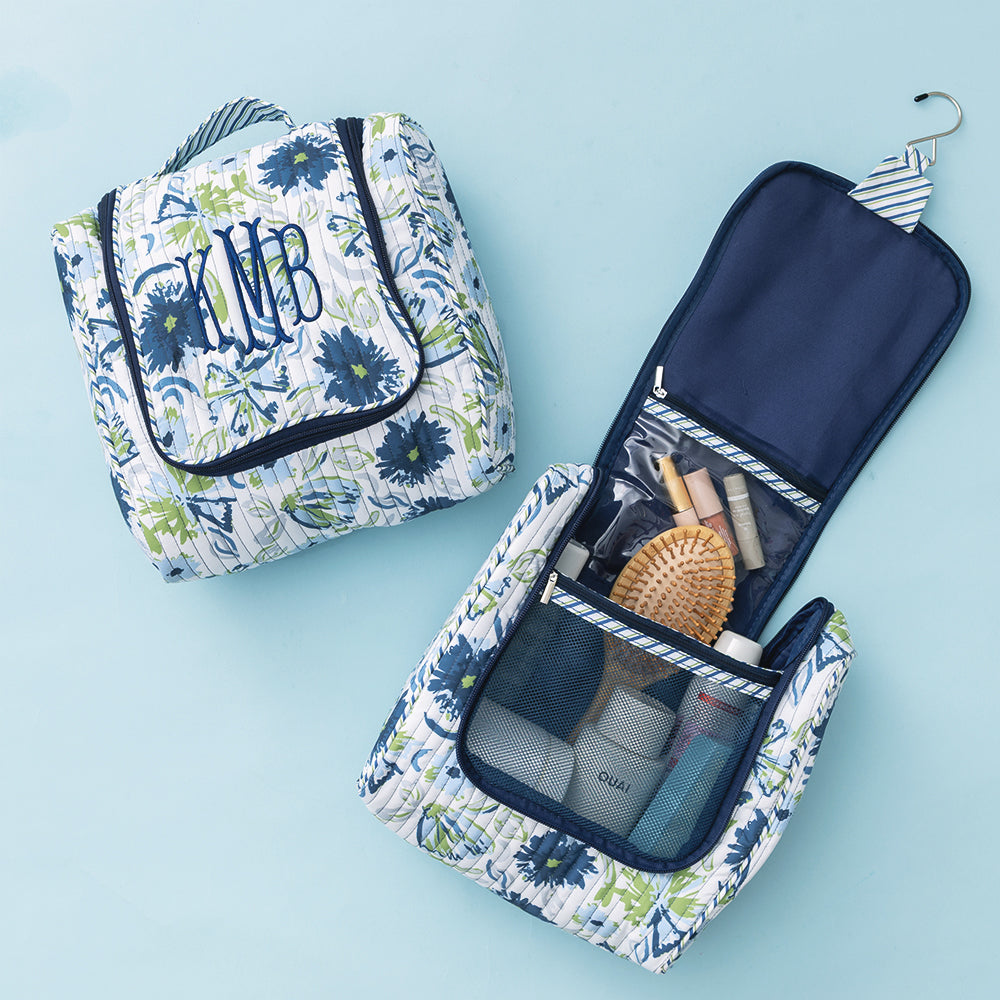 open and close personalized quilted hanging toiletry bag in indigo painted petals 
