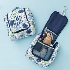 open and close personalized quilted hanging toiletry bag in indigo painted petals 