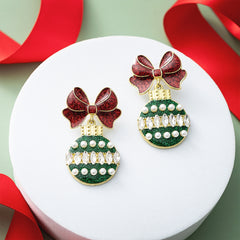 ornament christmas earrings on tray with ribbon