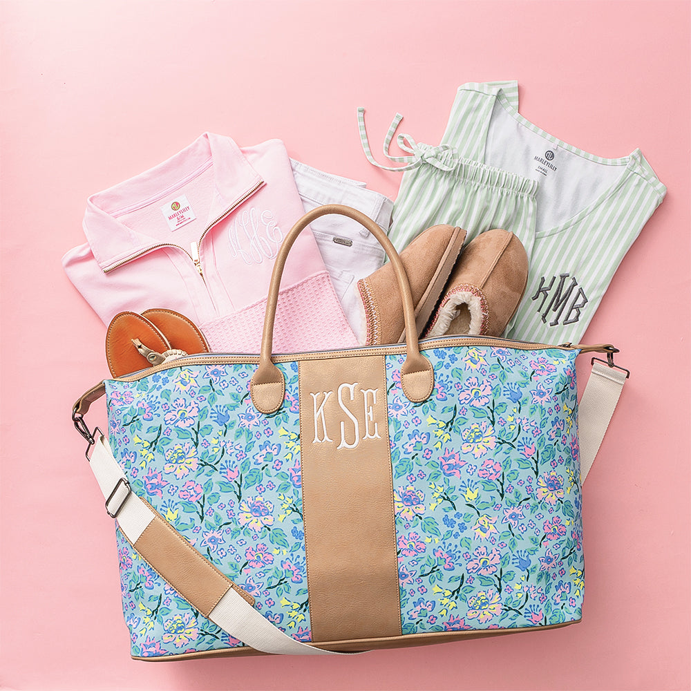 pastel flora trellis charleston weekender flatlay spillshot