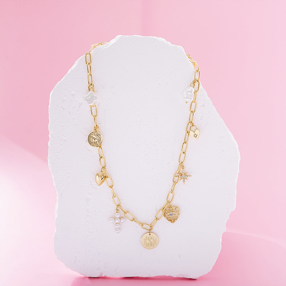 pearl signature charm necklace on pink