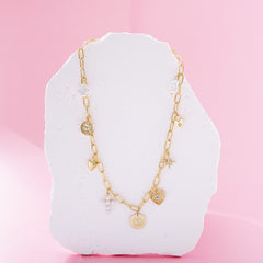 pearl signature charm necklace on pink