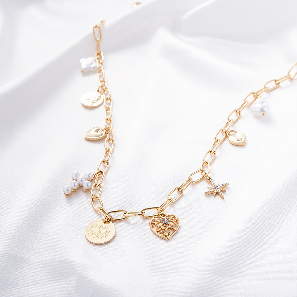 pearl signature charm necklace on white satin