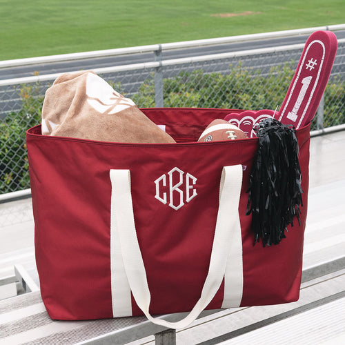 personalized extra large tote bag in red on stadium seats 