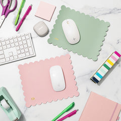 computer desk with monogrammed mouse pads, keyboard, and office items