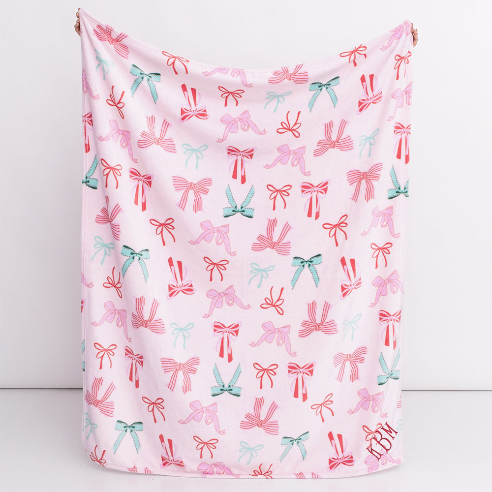 pink bows kids plush blanket in hands
