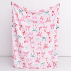pink bows kids plush blanket in hands