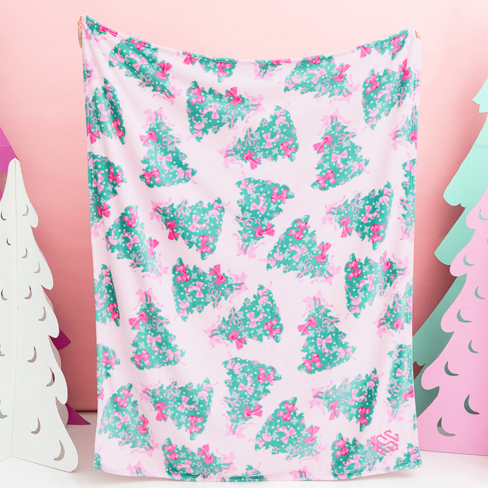 pink christmas trees blanket held up