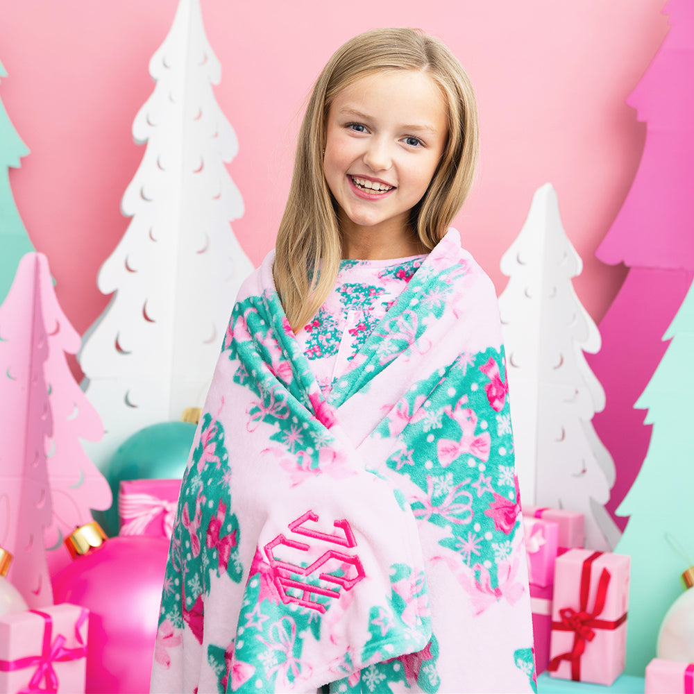 pink christmas tree kids plush blanket on addie up close