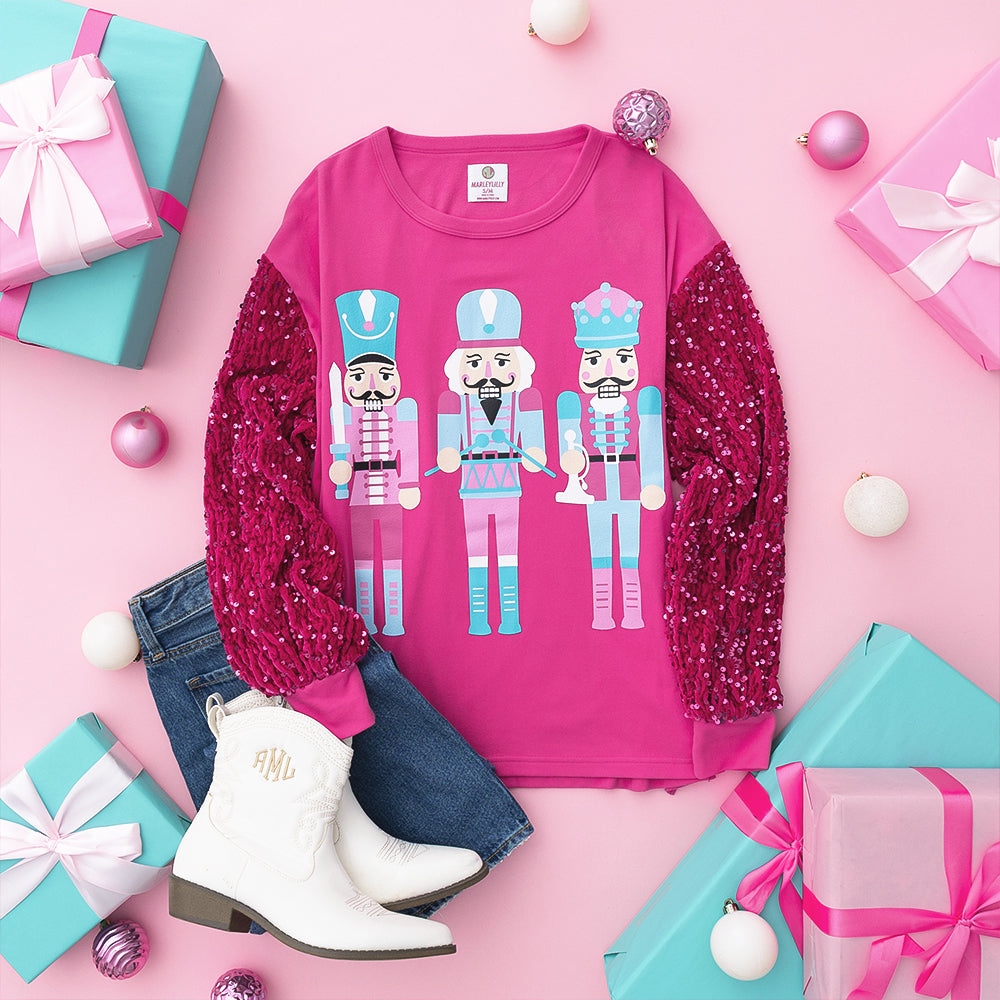 pink nutcracker sweatshirt flatlay
