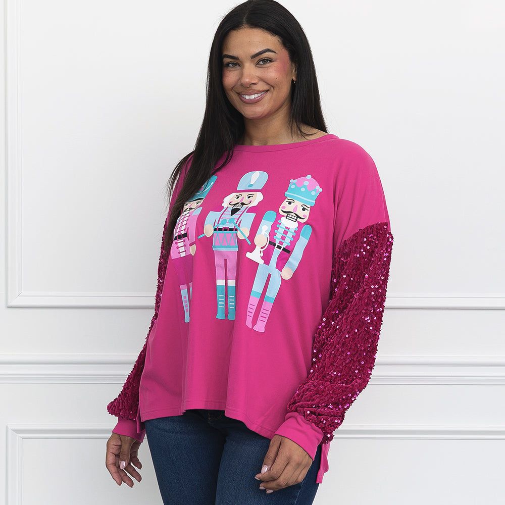 pink nutcracker sweatshirt on julia