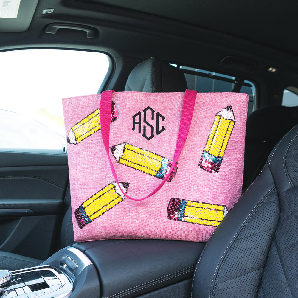 pink pencils monogrammed sequin tote bag in car 