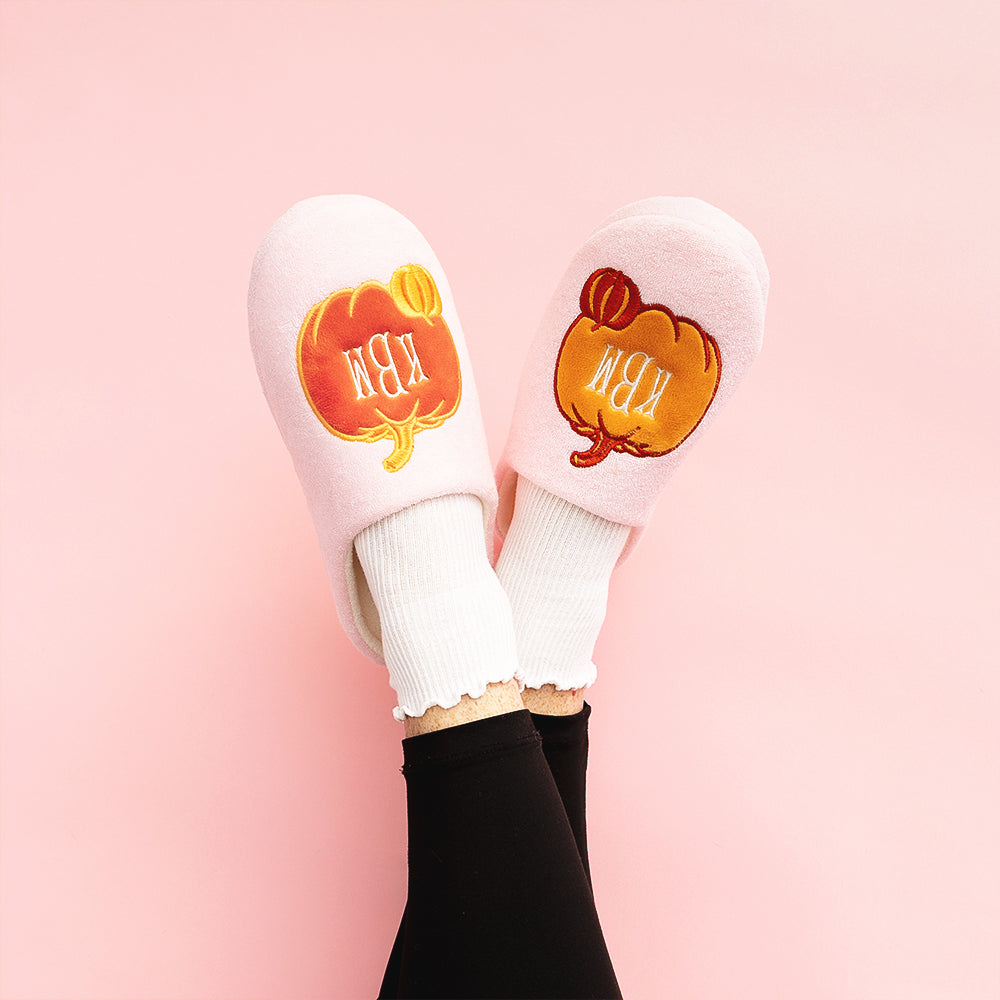pink pumpkins slippers on girl on pink