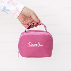 pink punch monogrammed makeup bag in hand 