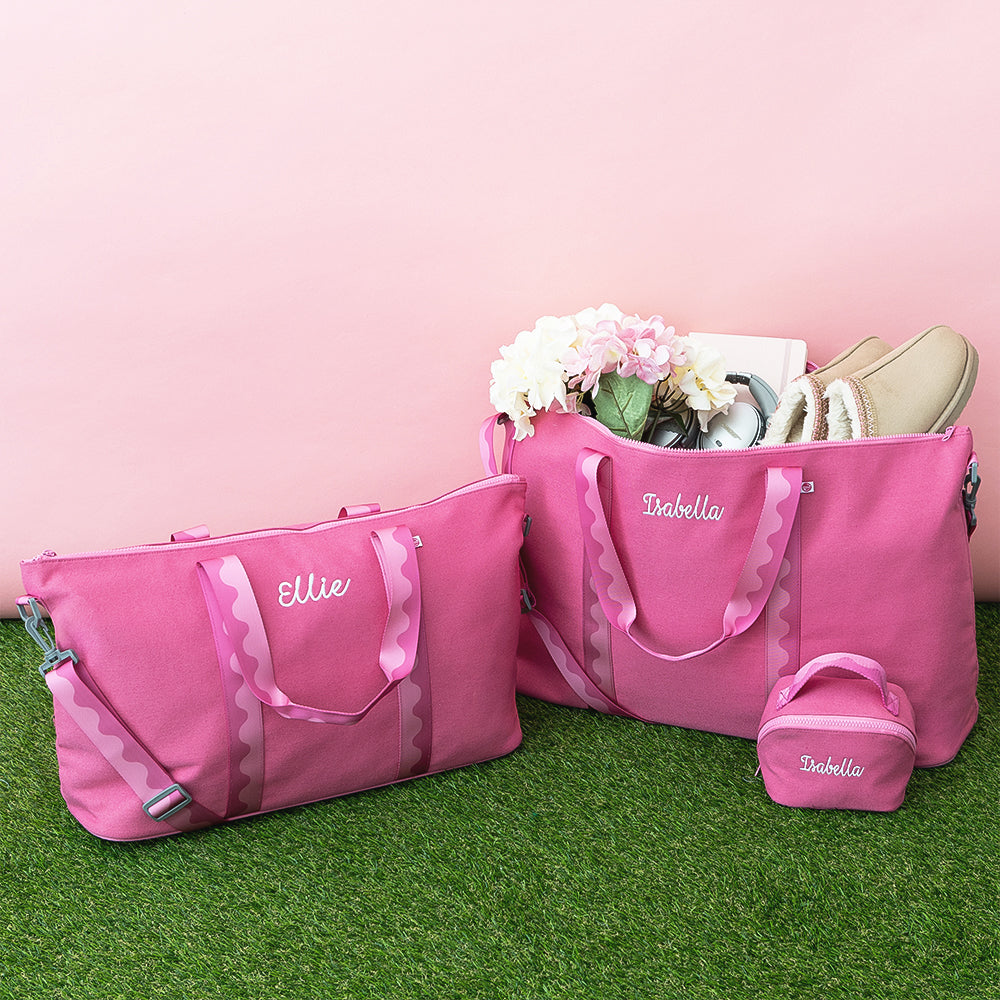 pink punch weekend bag kids weekend bag and makeup bag on grass