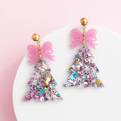 pink resin christmas trees on white dish