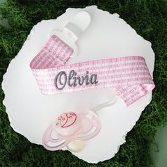 pink seersucker paci clip on moss